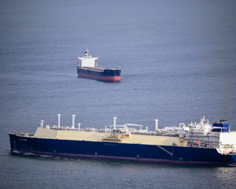 A cargo ship was hit by a projectile in the Strait of Hormuz, and the crew was evacuated